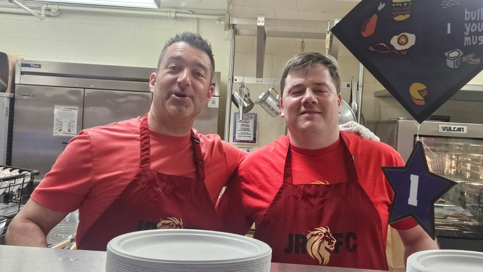 Fathers Club volunteers serving food at a school event